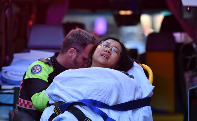 Woman Stabbed, Knife-Wielding Man Restrained By Public In Sydney