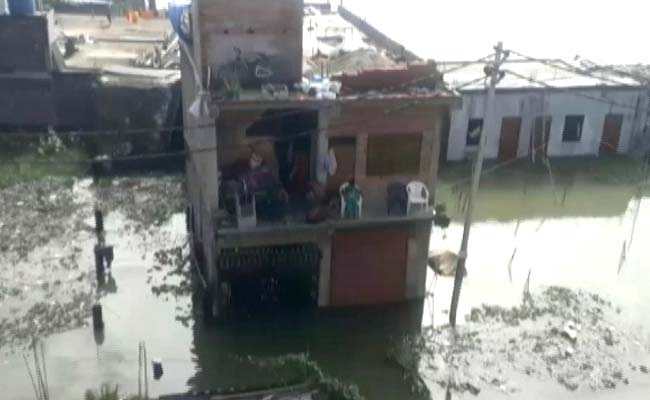 Rain In UP's Prayagraj Partially Submerges Houses, People Take Shelter On Rooftop