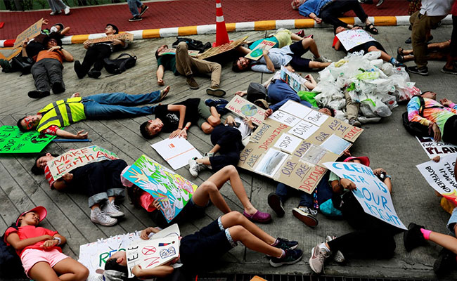 More Than 200 Young Climate Strikers "Drop Dead" At Thai Ministry