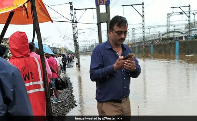 Engineer Stands In Flooded Mumbai Tracks For 16 Hours To Keep Trains Running