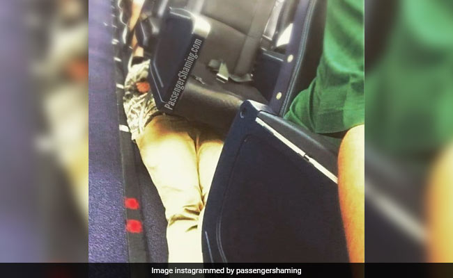 Visionary Or Vile? Pic Of Passenger Lying Under Airplane Seats Is Viral