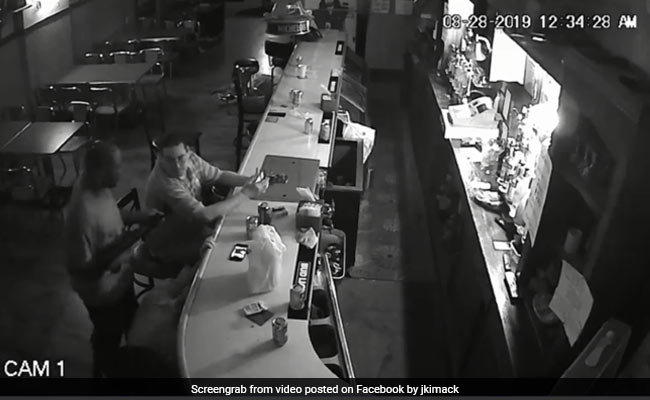 Man Refuses To Give Up Phone, Smokes Calmly During Armed Robbery. Watch