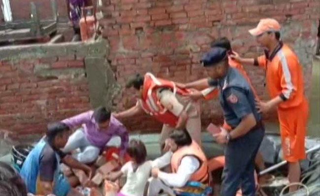 On Camera, Wall Collapses Injuring Varanasi Official During Flood Relief