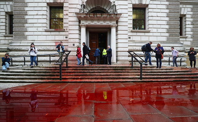 1,800 Litres Of "Fake Blood" Sprayed On UK Treasury By Climate Activists