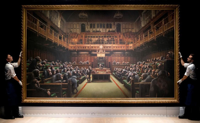 Banksy's UK Parliament Painting Sells For $12.1 Million At Auction