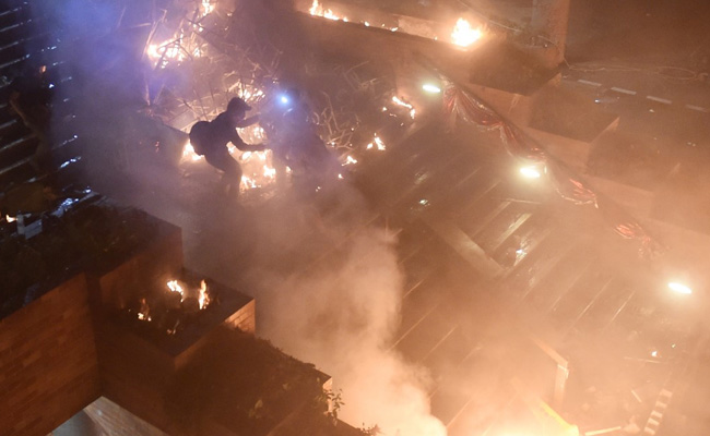 Fire Holds Off Hong Kong Police At Protest Campus