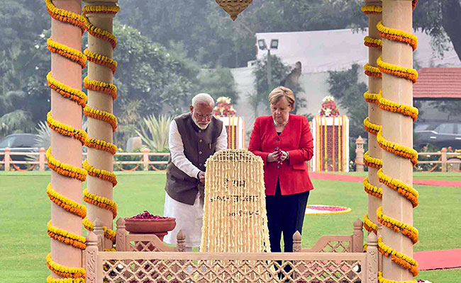 PM Modi, Angela Merkel Pay Homage To Mahatma Gandhi At Gandhi Smriti