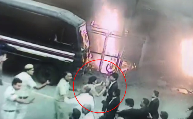Woman Officer Pleads With Folded Hands As Lawyers Charge At Cops In Video