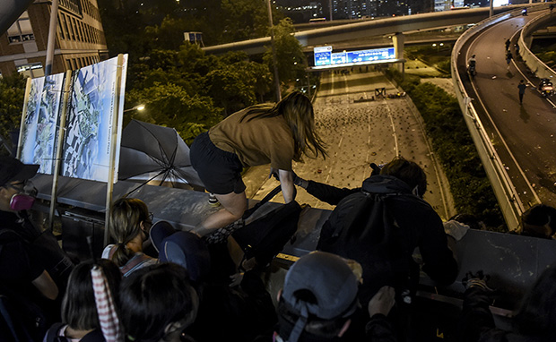 Video Shows Hong Kong Protesters' Daring Escape From University On Bikes