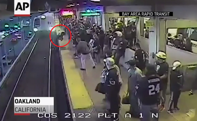 Man Pulled From Tracks Seconds Before Train Arrives In Dramatic Video