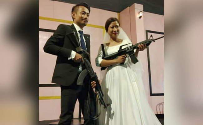 Naga Rebel's Son, Bride Flaunt Assault Rifles At Wedding Reception