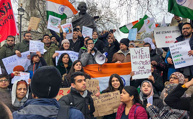 <i>"Azadi"</i> Slogans, Posters At Citizenship Protests At Mahatma Gandhi statue in London