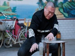 Beer-Drinking, Brick-Breaking Chinese Villager Becomes Twitter Sensation Beer-Drinking, Brick-Breaking Chinese Villager Becomes Twitter Sensation