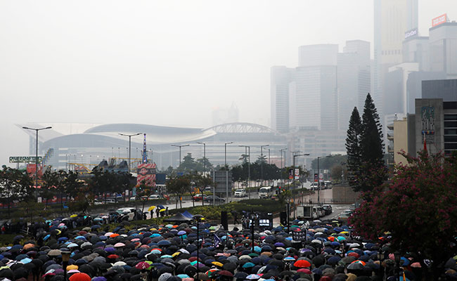 "Hong Kongers Will Never Stop": 1,000 Gather For Rain-Soaked Hong Kong Rally
