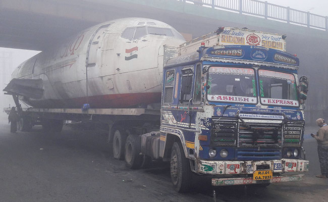 Truck Carrying Abandoned India Post Aircraft Gets Stuck Under Bridge In Bengal