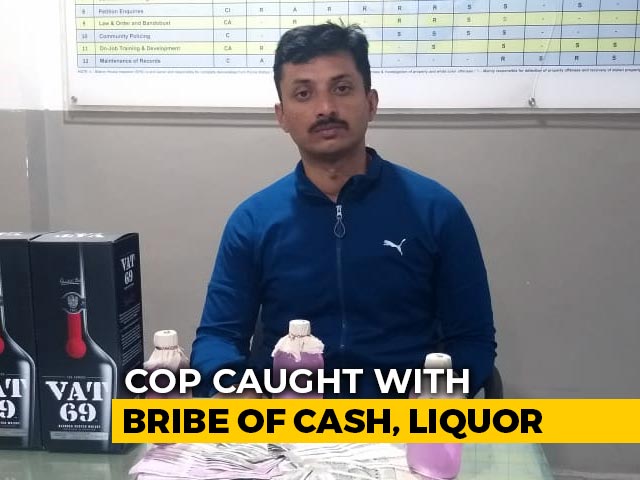 Hyderabad Cop Caught Taking Cash, Booze As Bribe In Businessman's Car