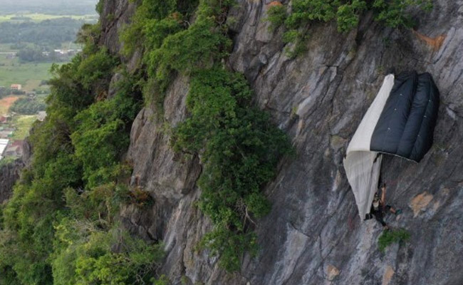 BASE Jumper Left Hanging After Parachute Gets Caught In Thailand Cliff