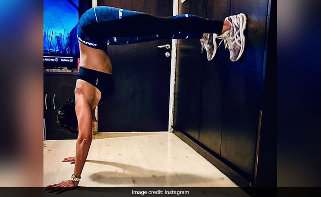 Can You Guess The Celeb In This Headstand Pic? Try To Spot Her Head At Least