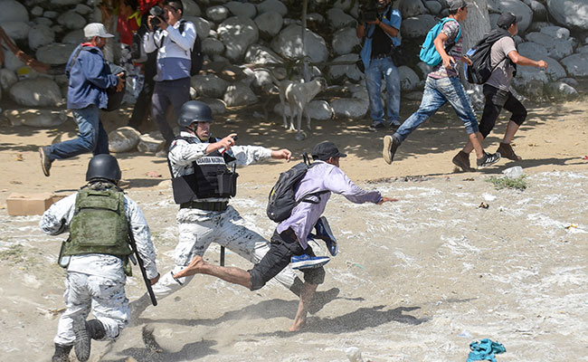 US-Bound Migrants' Caravan Clash With Mexico Forces At Guatemala Border