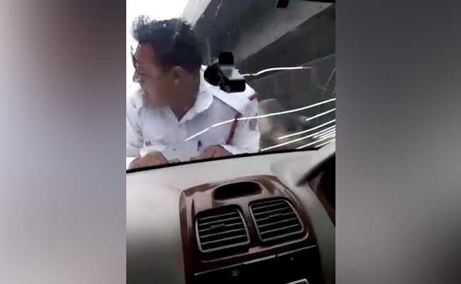 Delhi Cop Taken "Hostage" On Car Bonnet For 2 Km, Video Goes Viral