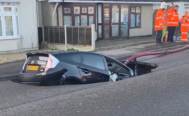 Motorist's Miracle Escape After Driving Car Into A Sinkhole