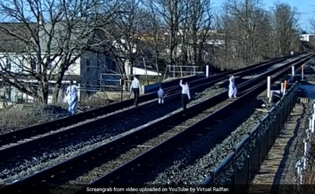 Narrow Escape For Family Taking Pics On Rail Tracks. Watch Scary Video