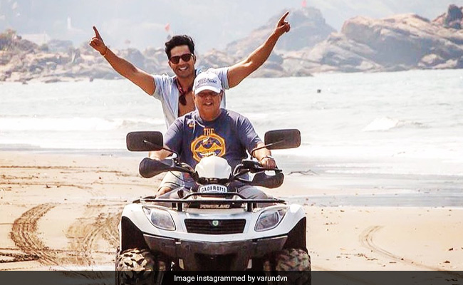 Varun Dhawan Chills With His "Daddy Cool" David Dhawan On The Sets Of Coolie No 1