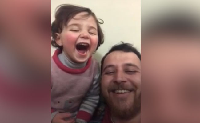 Syrian Dad Teaches Girl To Laugh At Explosions In Heart-Breaking Video