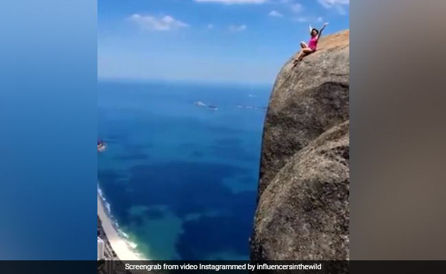 Internet Horrified By Tourist Posing On 2,800-Foot Mountain Edge. Watch
