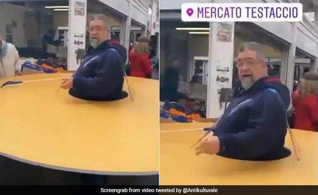 Man Wears Huge Cardboard Disc To Keep People Away Amid Coronavirus Fears