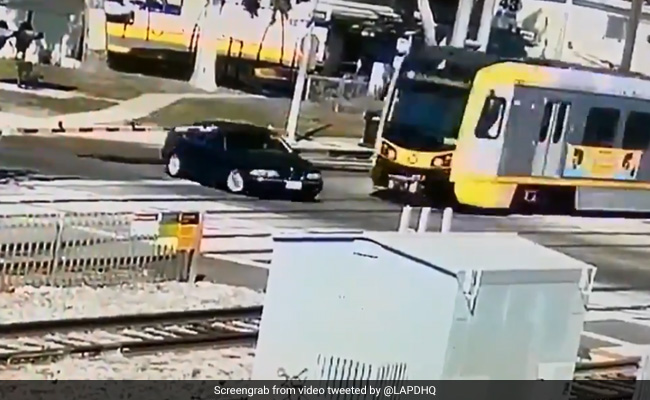 Horrifying Footage Shows BMW Getting Crushed By Train