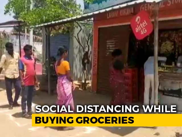 Fighting Coronavirus With Squares, Circles: Social Distancing At Stores