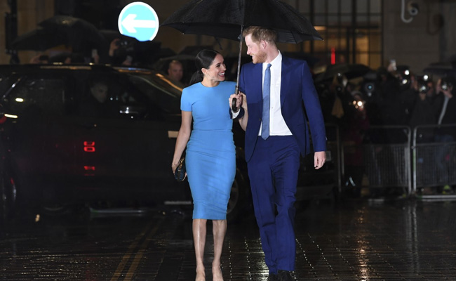 Harry, Meghan Share An Umbrella In London Rain. Pics Have Twitter Swooning