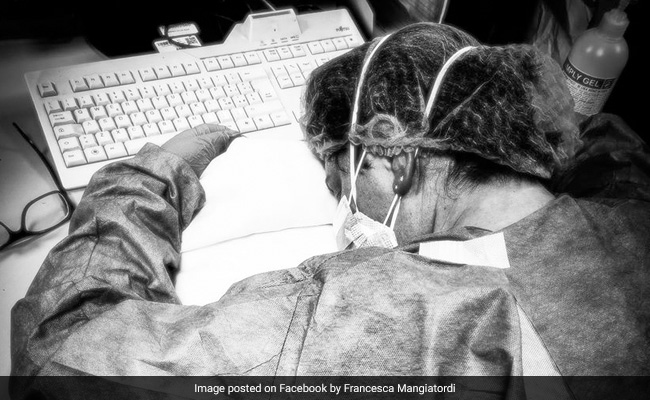 Worn-Out Nurse's Photo Shows Italy Health Workers' Fatigue In Virus Fight