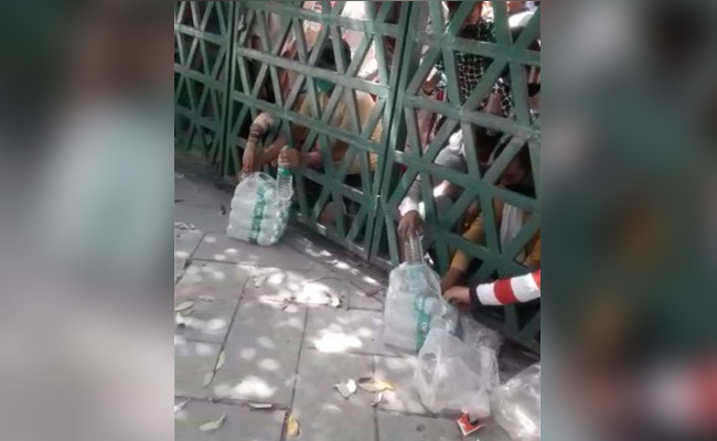Hands Reach For Water, Biscuits From Shut Gates At Agra Quarantine Unit