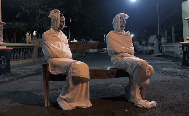 "Ghosts" Patrol Streets To Keep Indonesians Indoors And Away From Coronavirus