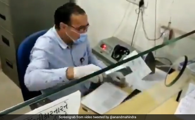 Watch: Banker 'Disinfects' Cheque, Netizens Applaud His Creativity