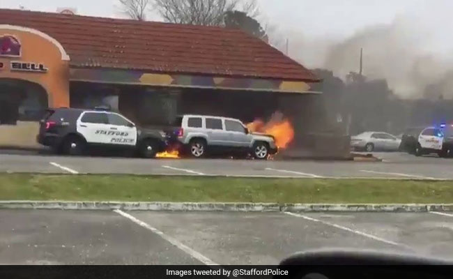 Quick-Thinking Cop Pushes Burning Car Away From Restaurant. Watch