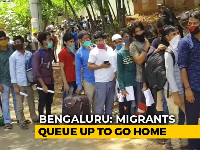 Amid pandemic, Migrants Queue Up At Bus Stops In Karnataka