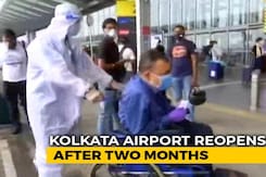 Airline Staff In Protective Gear Wheel Out Passengers At Kolkata Airport Airline Staff In Protective Gear Wheel Out Passengers At Kolkata Airport