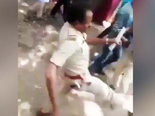 Video Shows Bengaluru Cop Kicking Migrants For Demanding Home Travel