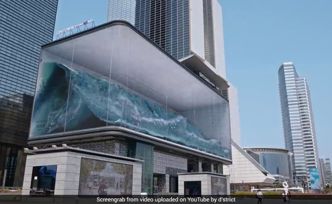 World's Biggest Virtual Wave Crashes Against Glass In Optical Illusion