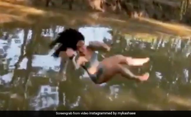 Woman Appears To Float Mid-Air While Falling Off Rope Swing In Bizarre Video