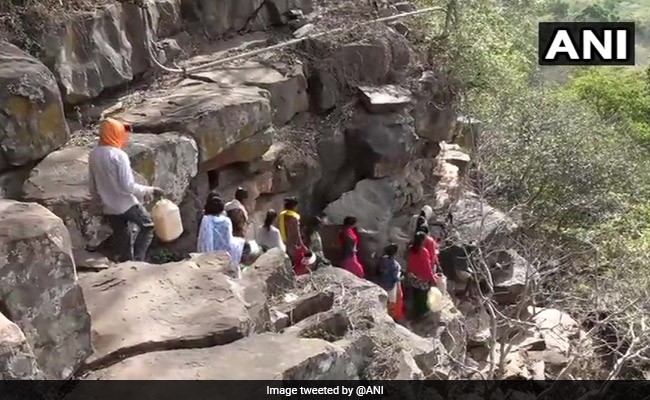 Madhya Pradesh Villagers Walk Through Rocky Terrain In Scorching Heat For Water