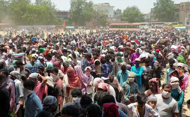 Desperate To Go Home, Migrants Swarm Ground Near Delhi For Buses