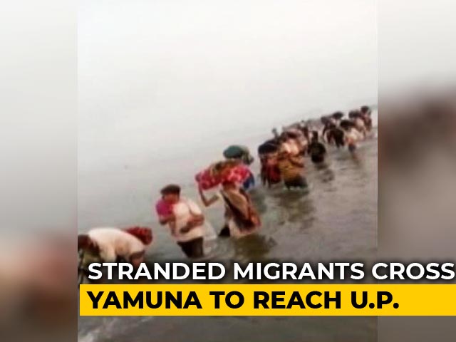 Stirring Photo Shows Migrants Crossing Knee-Deep Yamuna To Get Home