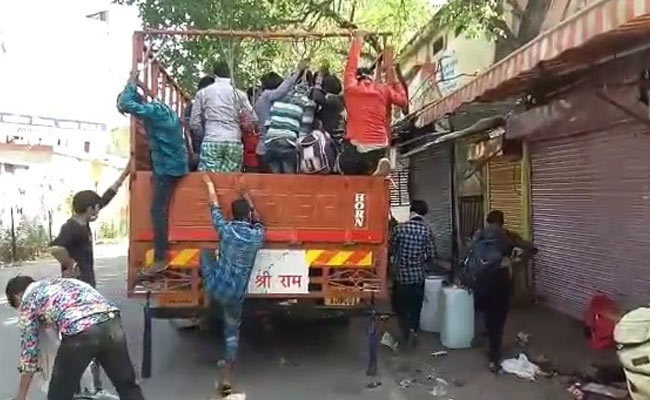 Migrants Move From Gujarat To Madhya Pradesh Cramped In Trucks, With Forged Passes