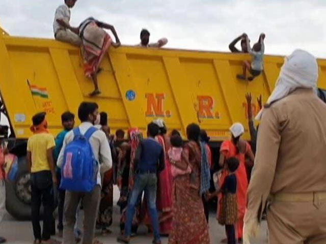 Migrants' Long Walk Home: Not Out Of Choice, But Desperation