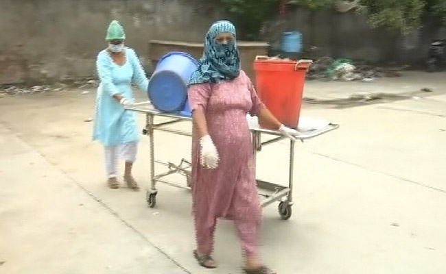 Staff At Amritsar's COVID-19 Hospital Use Stretchers To Carry Waste