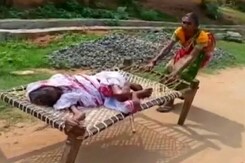 Odisha Woman Drags 100-Year-Old Mother On Cot To Bank For Paperwork Odisha Woman Drags 100-Year-Old Mother On Cot To Bank For Paperwork